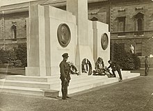 Former monument to Michael Collins and Arthur Griffith on Leinster Lawn, shown here in 1923 and removed in 1939 Mr John McCormack placing a wreath on the cenotaph erected to the memory of the late Michael Collins and Arthur Griffith at Leinster Lawn (16307907087).jpg