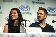 Munn with Deliver Us from Evil co-star Joel McHale at the 2014 WonderCon Olivia Munn & Joel McHale (13950135434).jpg