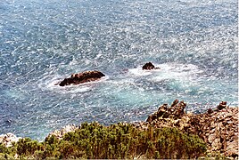 This view from the road shows the Seal Rocks. The swim-through is just inshore of the left of these rocks.