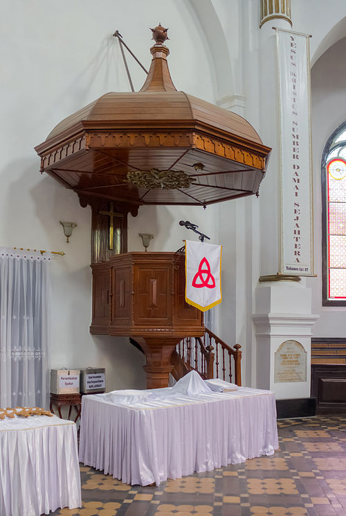 Pulpit at Blenduk Church in Semarang, Indonesia, with large sounding board and cloth antependium