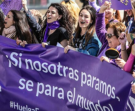 Purple placards and clothing at an International Women's Day event in Spain