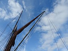 Mainsail brailed to the 'spreet' on SB Xylonite, head of the spar steadied by the vangs. SB Xylonite 3811.jpg