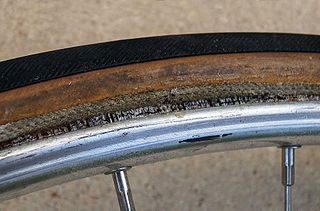 Tubular tyre bicycle tyre stitched closed around the inner tube to form a torus