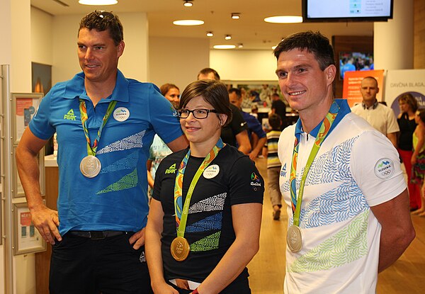 Three of four medalists at a promotional event in Ljubljana after the Games: Vasilij Žbogar (silver), Tina Trstenjak (gold) and Peter Kauzer (silver)