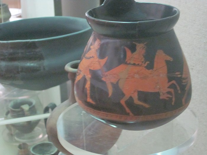 A Thracian mounted warrior followed by a warrior on foot.
