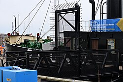 The new entrance gate of the Spurn Lightship in Hull Marina, Kingston upon Hull. The museum ship should hopefully reopen when paving and infrastructure work leading towards the Spurn is complete, thereby opening up the remainder of the marina pathway to pedestrian traffic once again.