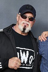 Scott Steiner joined the nWo at SuperBrawl VIII Steiner Brothers with a fan (cropped).jpg