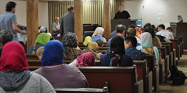 Sunday worship with Pastor Timothy Phelps at lectern, 2018