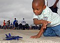US Navy 081025-N-1522S-097 A young boy plays with his Blue Angel model plane.jpg