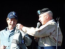Foxworthy accepting a new jacket from 3rd Infantry Division Commander Army Maj. Gen. William G. Webster for his support