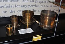 Standards for the gallon, half gallon, quart and pint formerly used in the Colony of Victoria. Now part of the National Archives of Australia. VolumeStandards(AU)-1.JPG