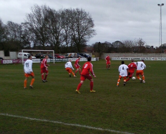 Walsall Wood (red shirts) in action against Racing Club Warwick