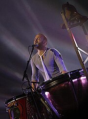 Champion performing Viva la Vida during the Viva la Vida Tour in 2009.