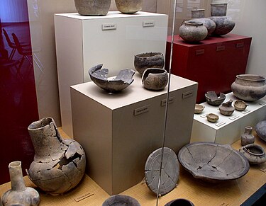 An assortment of pottery found at the site, on display at the site museum. Winterville pottery HRoe 2004.jpg