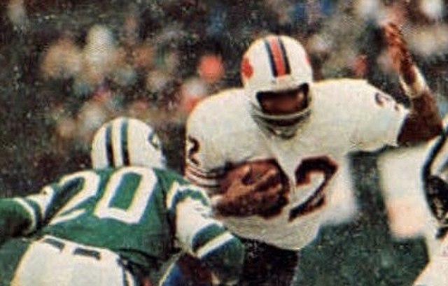 Running back O. J. Simpson, the face of the Bills franchise for most of the 1970s, pictured breaking the NFL's single-season rushing record in 1973