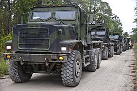 Designation for standard cargo 4.674 m wheelbase MTVRs is MK23 or MK25 (with winch). This MK23/MK25, on which the Oshkosh TAK-4 independent coil-spring suspension is clearly visible, is fitted with an armored cab