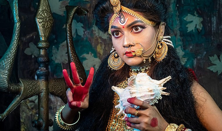 Woman dressed as Sherawali, the warrior goddess who rides a tiger, by TAPAS KUMAR HALDER