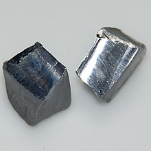 A piece of dark black metallic substance representing elemental lead.