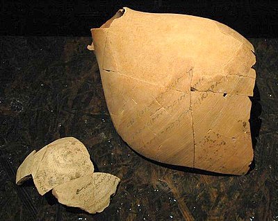 Broken ostracon from the Ai-Khanoum treasury, displaying inscription.