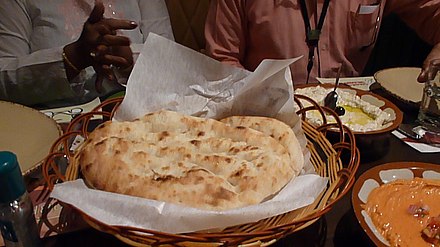 Flatbread and hummus at a restaurant in Manama