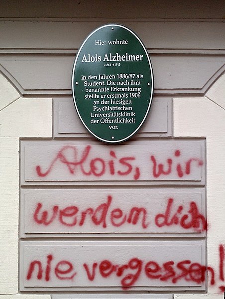 Humour can be a way of dealing with the menacing or unpleasant: Sprayed comment below a memorial plaque for Alois Alzheimer who first described the me