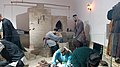 An uzbek blacksmiths working in their workshop