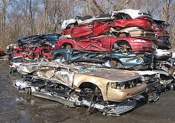 Crushed cars stacked at an auto scrapyard phot...