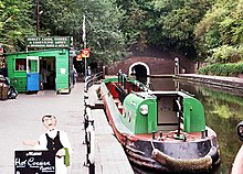 Dudley Canal Trust boat outside the Dudley Tunnel, behind the museum BCLM canal.jpg