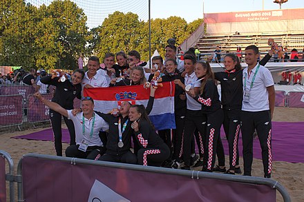 female and male Beach handball teams of Croatia celebrating the girls silver medail Beach handball at the 2018 Summer Youth Olympics - Medal Ceremony 06.jpg