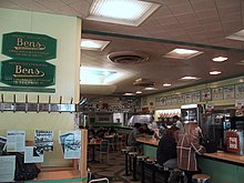 Inside beside the counter. Visible on the wall is a display of photos of celebrity customers. BensInterior2002.jpg