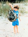 Boy with horseshoe crab shell.jpg