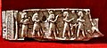 Carved ivory panel showing Egyptianized scene. From Nimrud, Iraq. Iraq Museum, Baghdad.jpg