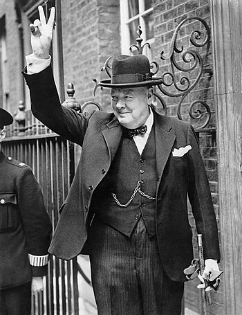 Winston Churchill in Downing Street giving his...