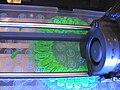 picture of Replicator 2 printing a bracelet ... can see two green pieces of the bracelet that were knocked off
