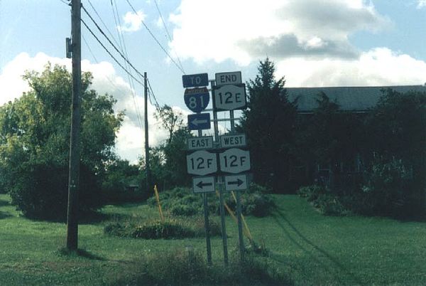 The signed southern terminus of NY 12E at the junction of NY 12F and Bridge Street in Brownville