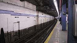 At East Broadway on the IND Sixth Avenue Line (shown), part of a two-track station was built for the IND Worth Street Line under East Broadway, above the existing line. The indent for the never-built line is seen at the top of the picture, crossing the ceiling. East Broadway Station.jpg