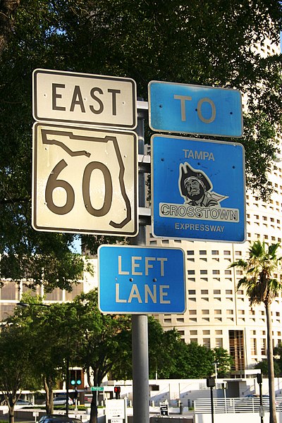A Florida State Road 60 sign on Kennedy Boulevard in Tampa, with an older Crosstown Expressway sign alongside.
