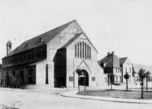 Church and clergy house shortly after completion in 1923 Gerardus Majellakerk, Tilburg front and clergy house.png