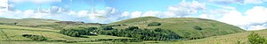 Glenbuck West farm and Glenbuck loch and surrounding hils from the SW.jpg