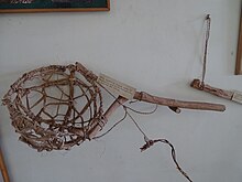 A hand held bamboo basket at display in the Honey and Bee Museum, Ooty. The basket was used to harvest honey by honeyhunters. Hand Held Basket from Ooty, Tamilnadu, India.JPG