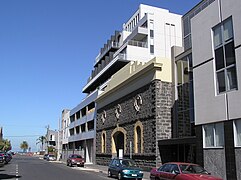 Heritage bluestone warehouse (1864) became part of a beach apartment in Port Melbourne