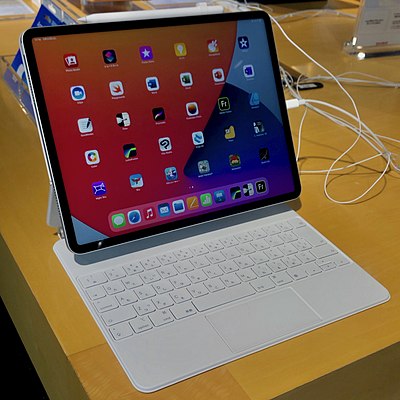 iPad Pro (5th generation) (May 2021) with a White Magic keyboard