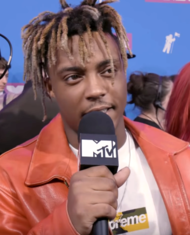 Juice Wrld (pictured) places five songs on the list, two of which are from his posthumously released third studio album Legends Never Die. Those two songs are "Come & Go" (with Marshmello) and "Wishing Well", which rank at number 54 and number 92 respectively. Juice Wrld VMAs.png