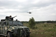 A Ukrainian soldier prepares to engage the opposition force during an air assault at Exercise Rapid Trident 16, July 2016 KrAZ Spartan of Ukrainian Airmobile Forces, Rapid Trident 2016.jpg