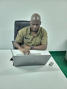 Kyuka Lilymjok at his UBEC office, International Conference Center, Abuja in 2023. Kyuka Lilymjok.jpg