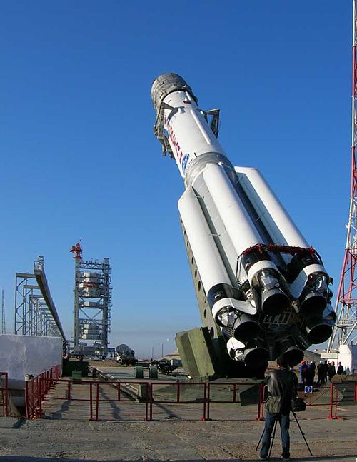 Proton-M, part being rotated to vertical. In the background, the mobile service tower can be observed.