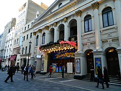 Image 34Music hall evolved into variety shows. First performed in 1912, the Royal Variety Performance was first held at the London Palladium (pictured) in 1941. Performed in front of members of the Royal Family, it is held annually in December and broadcast on television (from Culture of the United Kingdom)