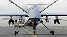 An armed MQ-9 Reaper on a taxiway at Kandahar Airfield. Although the MQ-9 is capable of carrying a variety of munitions, the Gorgon Stare MQ-9's are unarmed. MQ-9 Reaper taxis.jpg