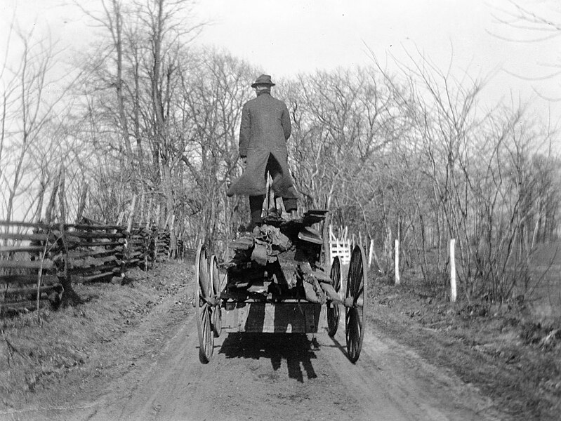 File:Man standing on wagon (5809695085).jpg