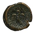 Monnaie en bronze avec au centre un aigle et une inscription latine SEMISSOS LEXOVIO PVPLIC] A